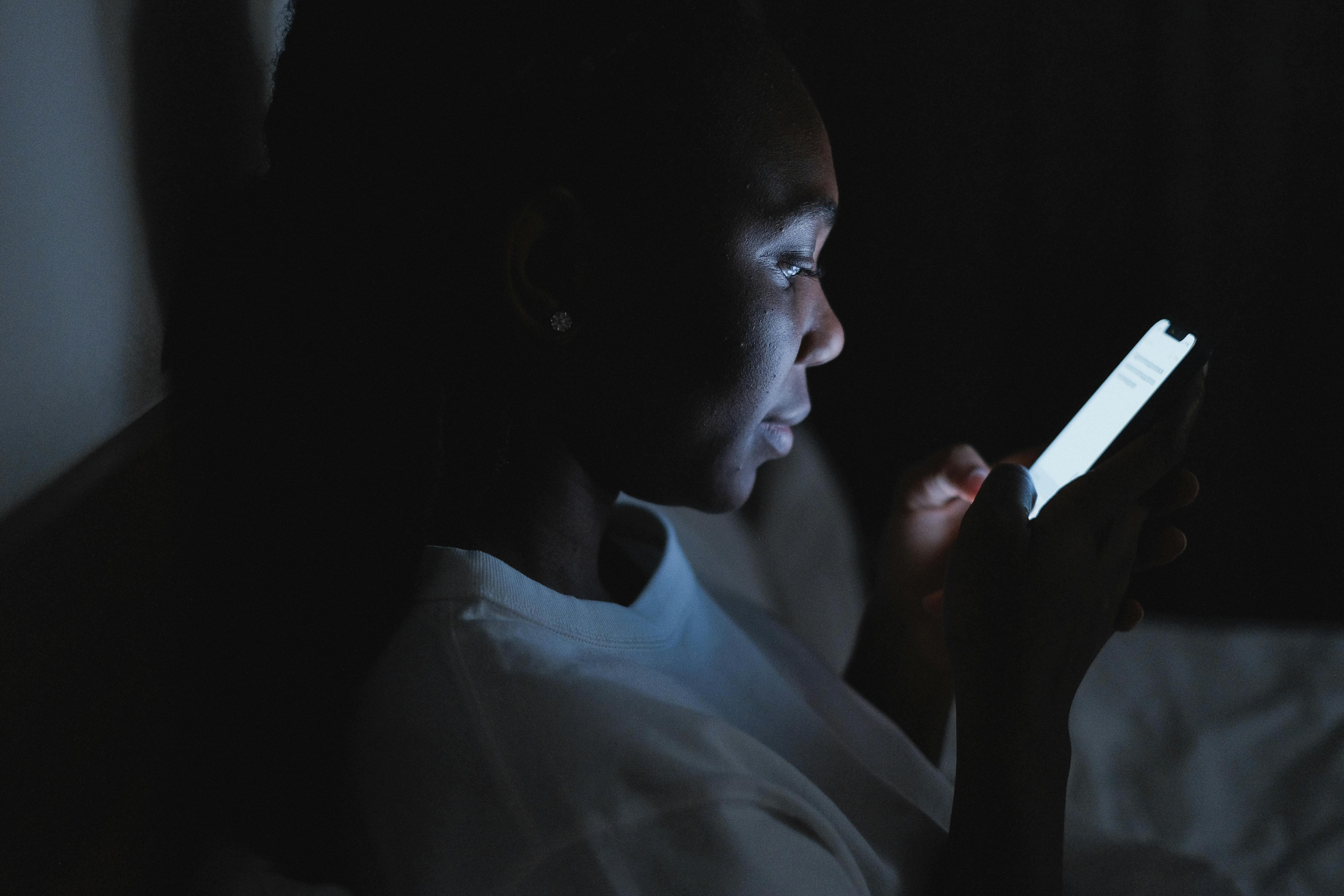 Girl Using Phone at Night